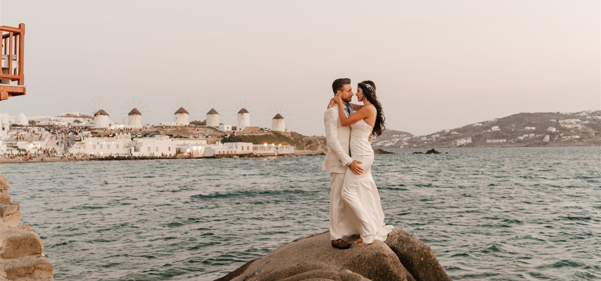 A professional photographer capturing a romantic elopement in Mykonos, Greece.