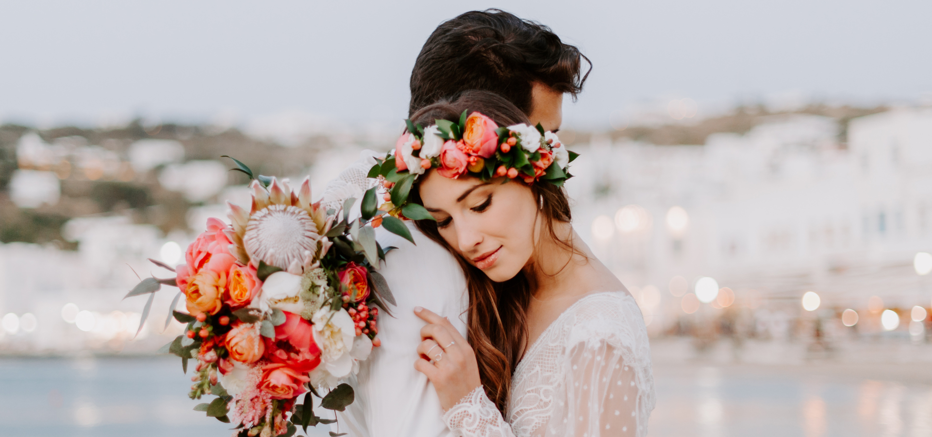 A professional photographer capturing a wedding ceremony in Mykonos, Greece.